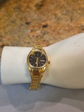 Miykon Gold Tone Wristwatch with Black Dial 6.5  In